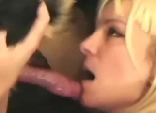 Blonde lady practicing her oral skills with a dog